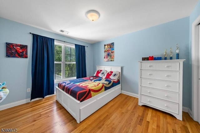 143 Oak St, Bridgewater Twp, NJ 08807 - bedroom with light wood finished floors and baseboards