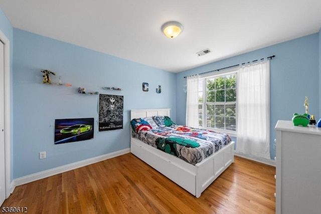 143 Oak St, Bridgewater Twp, NJ 08807 - bedroom featuring light wood finished floors and baseboards