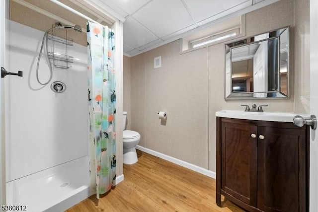 143 Oak St, Bridgewater Twp, NJ 08807 - bathroom with toilet, wood finished floors, a shower with shower curtain, vanity, and baseboards
