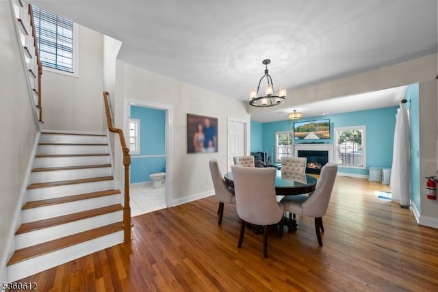143 Oak St, Bridgewater Twp, NJ 08807 - dining space with wood finished floors, stairway, a chandelier, and baseboards