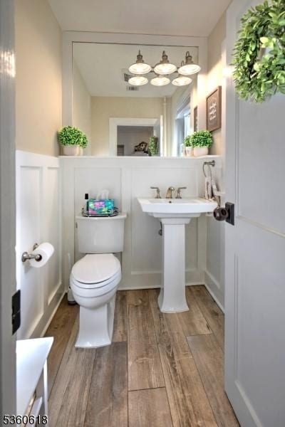 22 Somerset Ave, Bernardsville Boro, NJ 07924 - half bath featuring wood finished floors and toilet