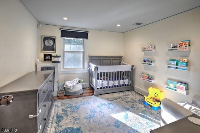 22 Somerset Ave, Bernardsville Boro, NJ 07924 - bedroom featuring a nursery area, wood finished floors, and recessed lighting