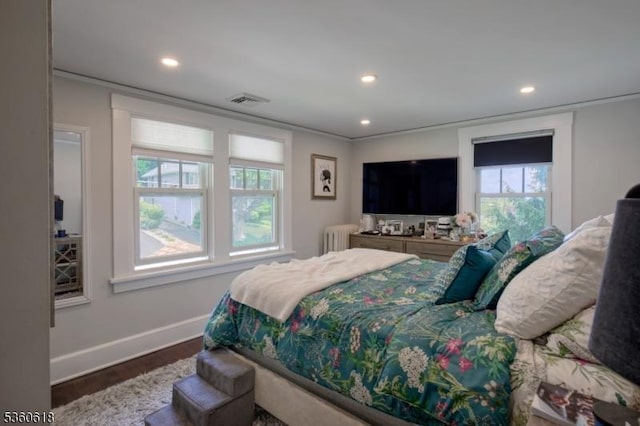 22 Somerset Ave, Bernardsville Boro, NJ 07924 - bedroom with wood finished floors, radiator heating unit, recessed lighting, and crown molding