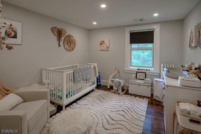 22 Somerset Ave, Bernardsville Boro, NJ 07924 - bedroom with dark wood-style flooring, recessed lighting, and a crib