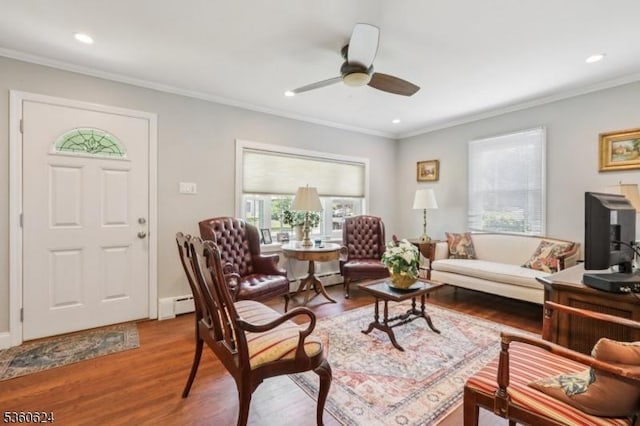 29 Union Ave, New Providence Boro, NJ 07974 - living room featuring plenty of natural light, wood finished floors, a ceiling fan, crown molding, and a baseboard radiator