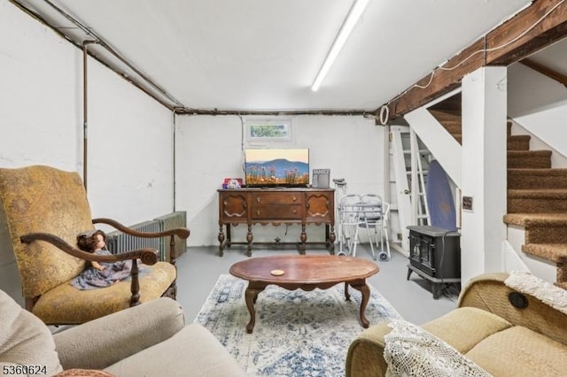 29 Union Ave, New Providence Boro, NJ 07974 - living area featuring finished concrete floors, a wood stove, and stairs