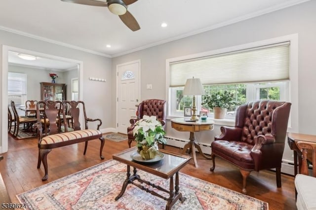 29 Union Ave, New Providence Boro, NJ 07974 - living area featuring a baseboard heating unit, healthy amount of natural light, ceiling fan, hardwood / wood-style floors, and ornamental molding