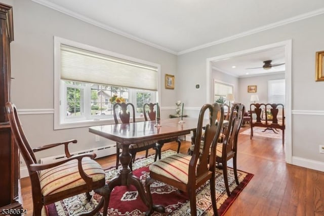 29 Union Ave, New Providence Boro, NJ 07974 - dining space featuring wood finished floors, crown molding, a baseboard heating unit, and a ceiling fan