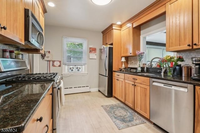 29 Union Ave, New Providence Boro, NJ 07974 - kitchen with stainless steel appliances, baseboard heating, decorative backsplash, dark stone countertops, and recessed lighting