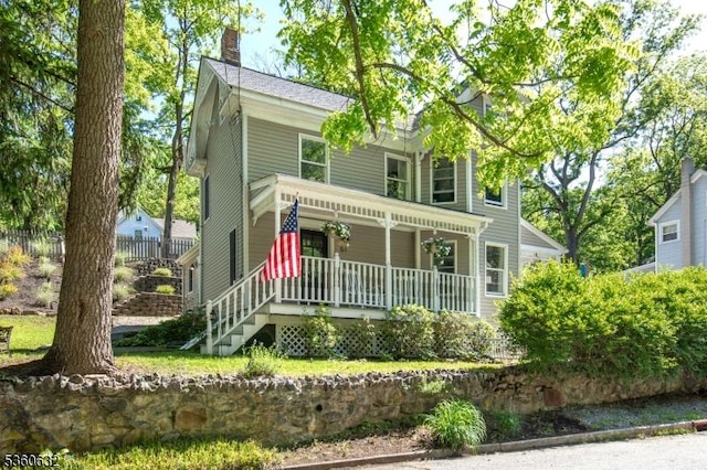 51 E Main St, High Bridge Boro, NJ 08829 - view of front of home featuring a porch and a chimney