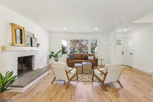 541 Westfield Rd, Scotch Plains Twp, NJ 07076 - living room with light wood-type flooring, a fireplace with raised hearth, recessed lighting, and baseboards