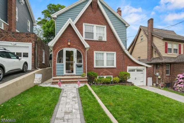 126 Beech St, Nutley Twp, NJ 07110 - english style home featuring brick siding, a front yard, a chimney, and driveway