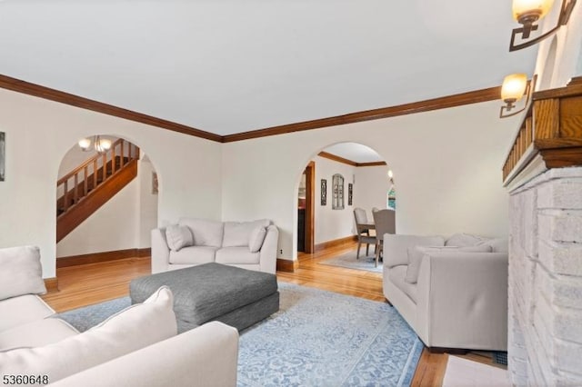 126 Beech St, Nutley Twp, NJ 07110 - living room with arched walkways, stairs, wood finished floors, and crown molding