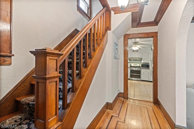 126 Beech St, Nutley Twp, NJ 07110 - stairs featuring a ceiling fan, crown molding, wood finished floors, and baseboards