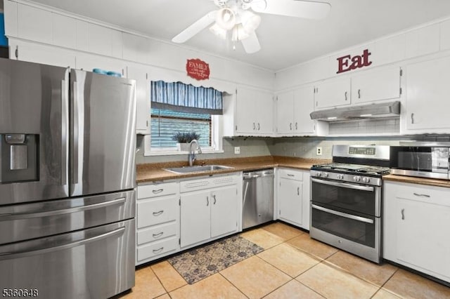 126 Beech St, Nutley Twp, NJ 07110 - kitchen featuring stainless steel appliances, a sink, ceiling fan, light tile patterned flooring, and white cabinetry