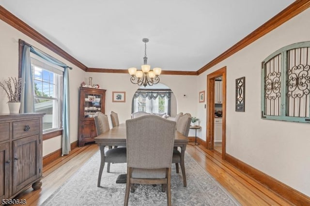 126 Beech St, Nutley Twp, NJ 07110 - dining space with a chandelier, light wood-style floors, baseboards, and crown molding