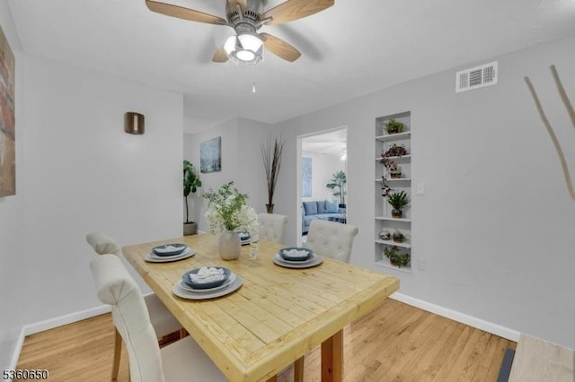 323 Gill Ln Unit Q, Woodbridge Twp, NJ 08830 - dining space with light wood-type flooring, baseboards, and ceiling fan