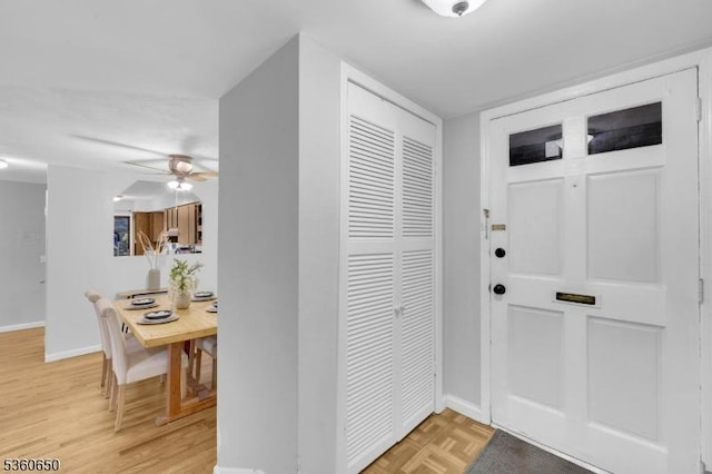 323 Gill Ln Unit Q, Woodbridge Twp, NJ 08830 - foyer with baseboards, a ceiling fan, and light wood-style flooring