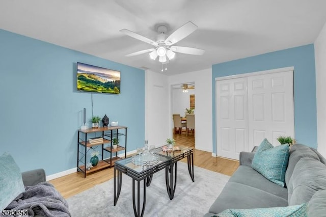 323 Gill Ln Unit Q, Woodbridge Twp, NJ 08830 - living room featuring ceiling fan, light wood-style floors, and baseboards
