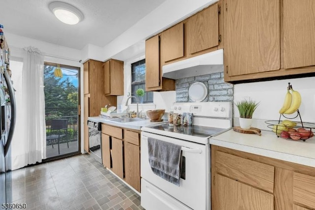 323 Gill Ln Unit Q, Woodbridge Twp, NJ 08830 - kitchen with white electric range, under cabinet range hood, a sink, light countertops, and dishwasher