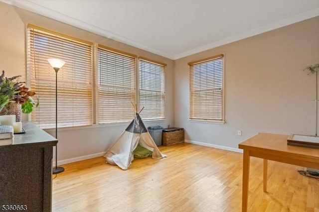 40 Upsala Ct, East Orange City, NJ 07017 - game room featuring baseboards, wood finished floors, plenty of natural light, and crown molding