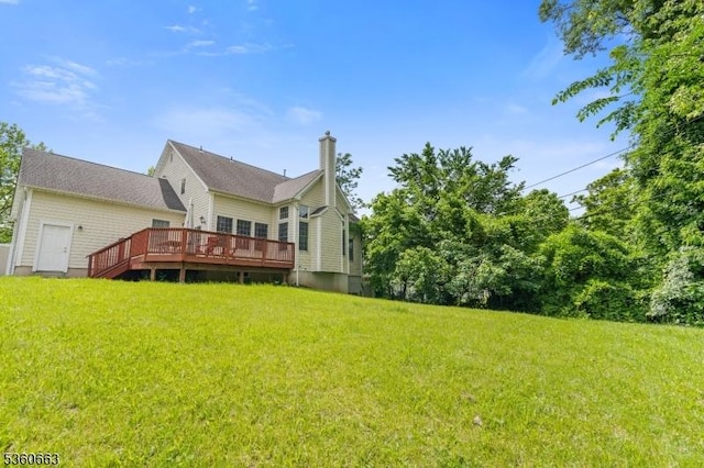 40 Upsala Ct, East Orange City, NJ 07017 - rear view of house featuring a deck, a chimney, and a lawn