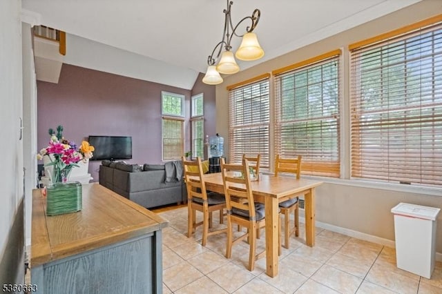 40 Upsala Ct, East Orange City, NJ 07017 - dining room with light tile patterned flooring, baseboards, and vaulted ceiling