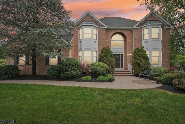 9 Labaw Way, Montgomery Twp, NJ 08502 - view of front facade featuring a lawn, brick siding, and roof with shingles