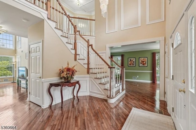 9 Labaw Way, Montgomery Twp, NJ 08502 - entrance foyer featuring a high ceiling, wood finished floors, stairway, crown molding, and baseboards