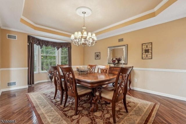 9 Labaw Way, Montgomery Twp, NJ 08502 - dining space with a raised ceiling, wood finished floors, a chandelier, crown molding, and baseboards