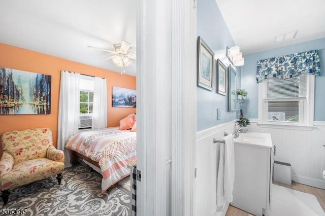 126 Smith Rd, Franklin Twp, NJ 08873 - bedroom with wainscoting, a sink, and ceiling fan