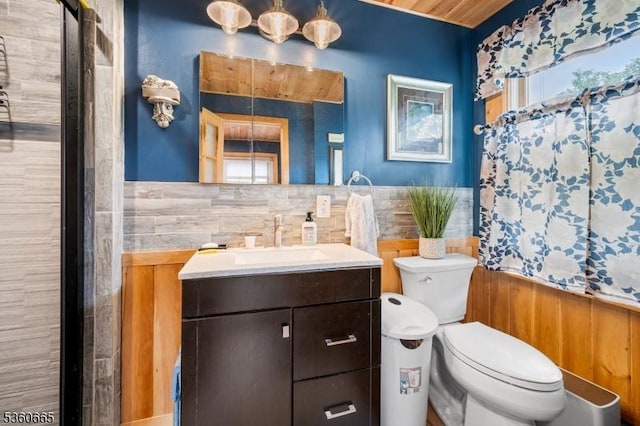 126 Smith Rd, Franklin Twp, NJ 08873 - full bath with toilet, wainscoting, vanity, a shower, and tile walls