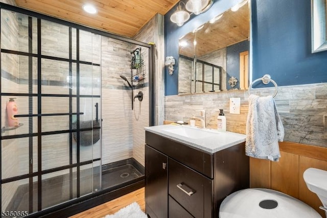 126 Smith Rd, Franklin Twp, NJ 08873 - full bathroom with tile walls, a shower stall, vanity, toilet, and recessed lighting