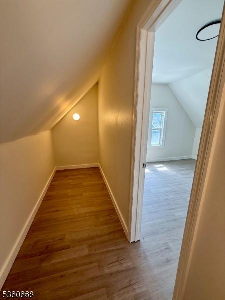 67 Mead St, Newark City, NJ 07106 - bonus room with vaulted ceiling, wood finished floors, and baseboards