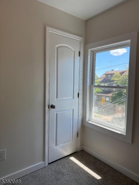 67 Mead St, Newark City, NJ 07106 - carpeted spare room with baseboards