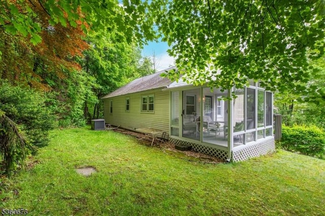 291 Germantown Rd, West Milford Twp, NJ 07480 - back of property featuring a sunroom, a yard, and central air condition unit