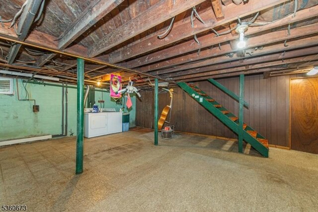 291 Germantown Rd, West Milford Twp, NJ 07480 - unfinished basement with washer and clothes dryer, stairs, and wood walls