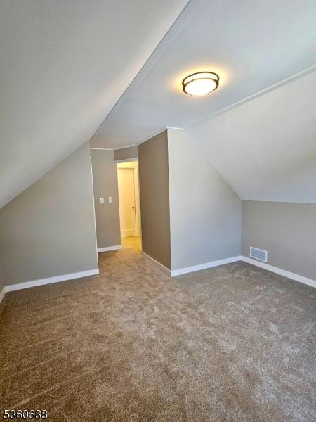 36 Webster Ave, Summit City, NJ 07901 - bonus room featuring lofted ceiling, carpet flooring, and baseboards