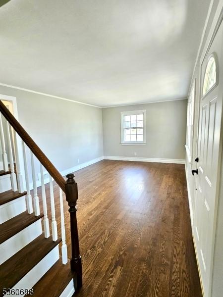 36 Webster Ave, Summit City, NJ 07901 - entrance foyer with crown molding, dark wood finished floors, baseboards, and stairs