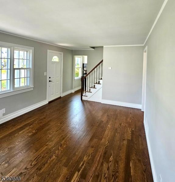 36 Webster Ave, Summit City, NJ 07901 - foyer featuring stairs, wood finished floors, crown molding, and baseboards