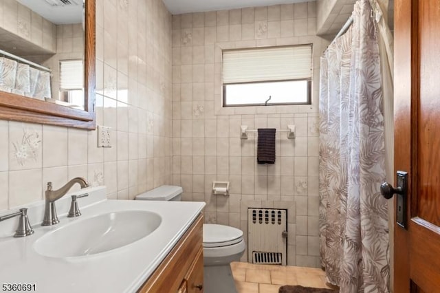 421 Lake Ave, Lyndhurst Twp, NJ 07071 - bathroom featuring radiator, tile walls, toilet, vanity, and a shower with curtain