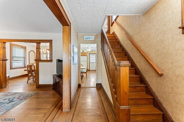 421 Lake Ave, Lyndhurst Twp, NJ 07071 - stairway with hardwood / wood-style floors, healthy amount of natural light, baseboards, and wallpapered walls