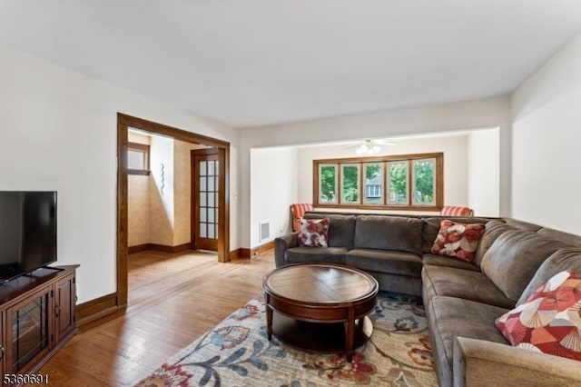 421 Lake Ave, Lyndhurst Twp, NJ 07071 - living area featuring light wood-type flooring, baseboards, and a ceiling fan