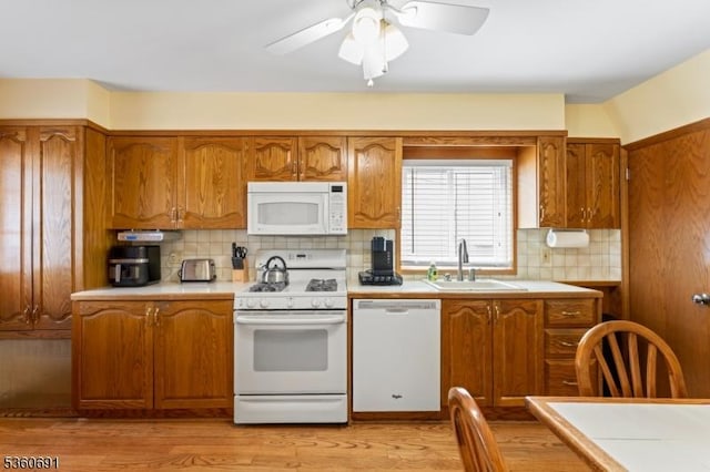421 Lake Ave, Lyndhurst Twp, NJ 07071 - kitchen featuring white appliances, a sink, and brown cabinets