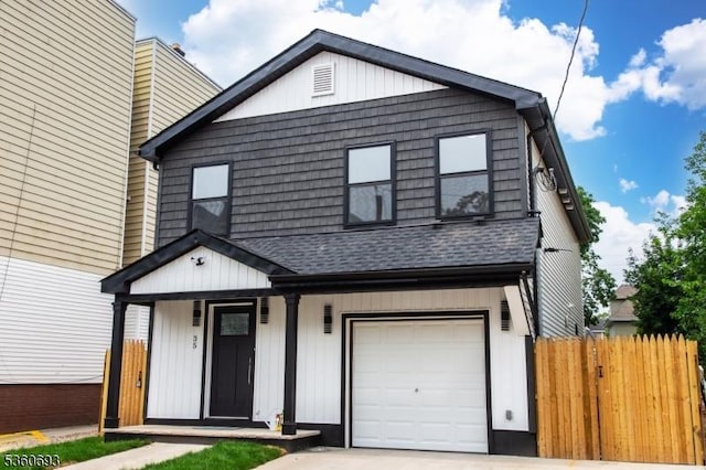 35 Ellis Ave, Irvington Twp, NJ 07111 - view of front facade with an attached garage, a shingled roof, and a porch