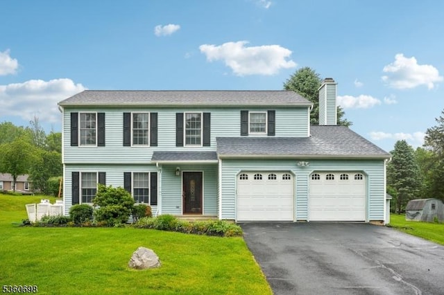 7 Michael Ct, Green Twp, NJ 07860 - view of front of house with asphalt driveway, a front yard, and a chimney