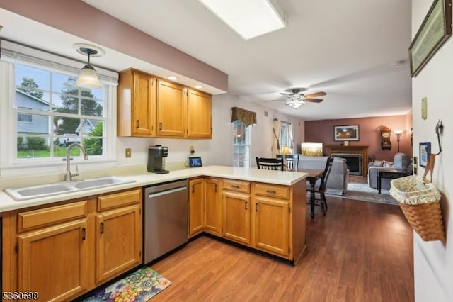7 Michael Ct, Green Twp, NJ 07860 - kitchen featuring dishwasher, a sink, a peninsula, light countertops, and wood finished floors
