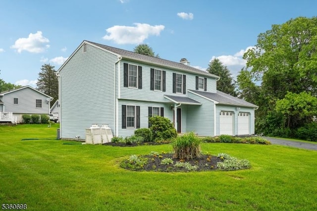 7 Michael Ct, Green Twp, NJ 07860 - view of front of house featuring a front yard, asphalt driveway, a chimney, and an attached garage