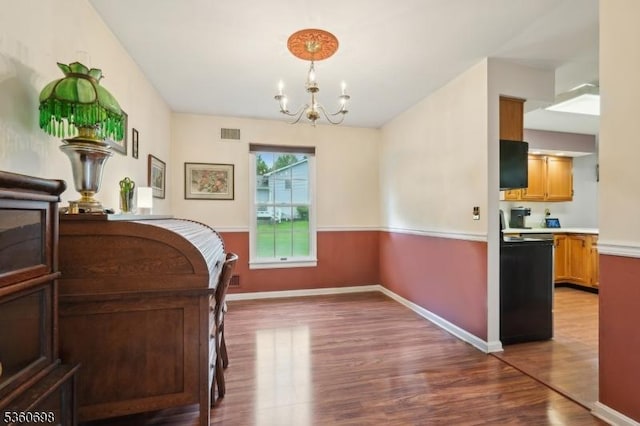 7 Michael Ct, Green Twp, NJ 07860 - dining area featuring a chandelier, wood finished floors, and baseboards