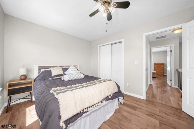424 Willow Ct, Raritan Twp, NJ 08822 - bedroom with a closet, wood finished floors, baseboards, and a ceiling fan